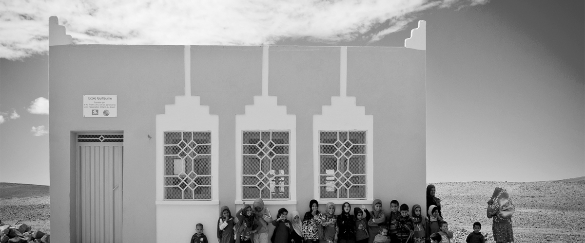 Children lined up outside a village school